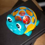 Oball Autó és csörgő, 2in1 Curious Car, teknős, Neptune™, 3 hó+
